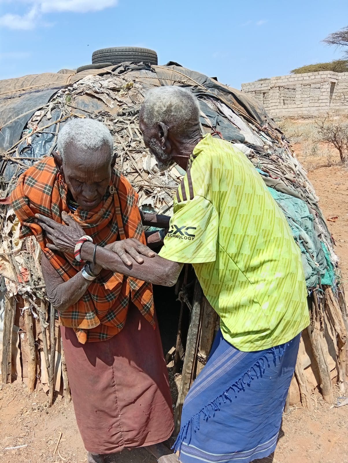 NCOA team member helping an elderly woman at her home